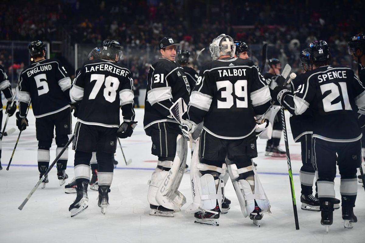 Apr 18, 2024; Los Angeles, California, USA; Los Angeles Kings celebrate the overtime goal scored by right wing Adrian Kempe (9) against the Chicago Blackhawks for the victory at Crypto.com Arena.
