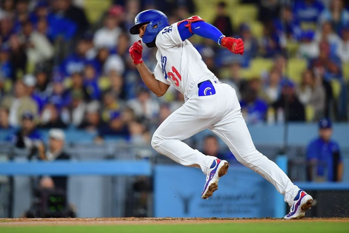 Sep 21, 2023; Los Angeles, California, USA; Los Angeles Dodgers second baseman Amed Rosario (31) runs after hitting a single against the San Francisco Giants during the fourth inning at Dodger Stadium.
