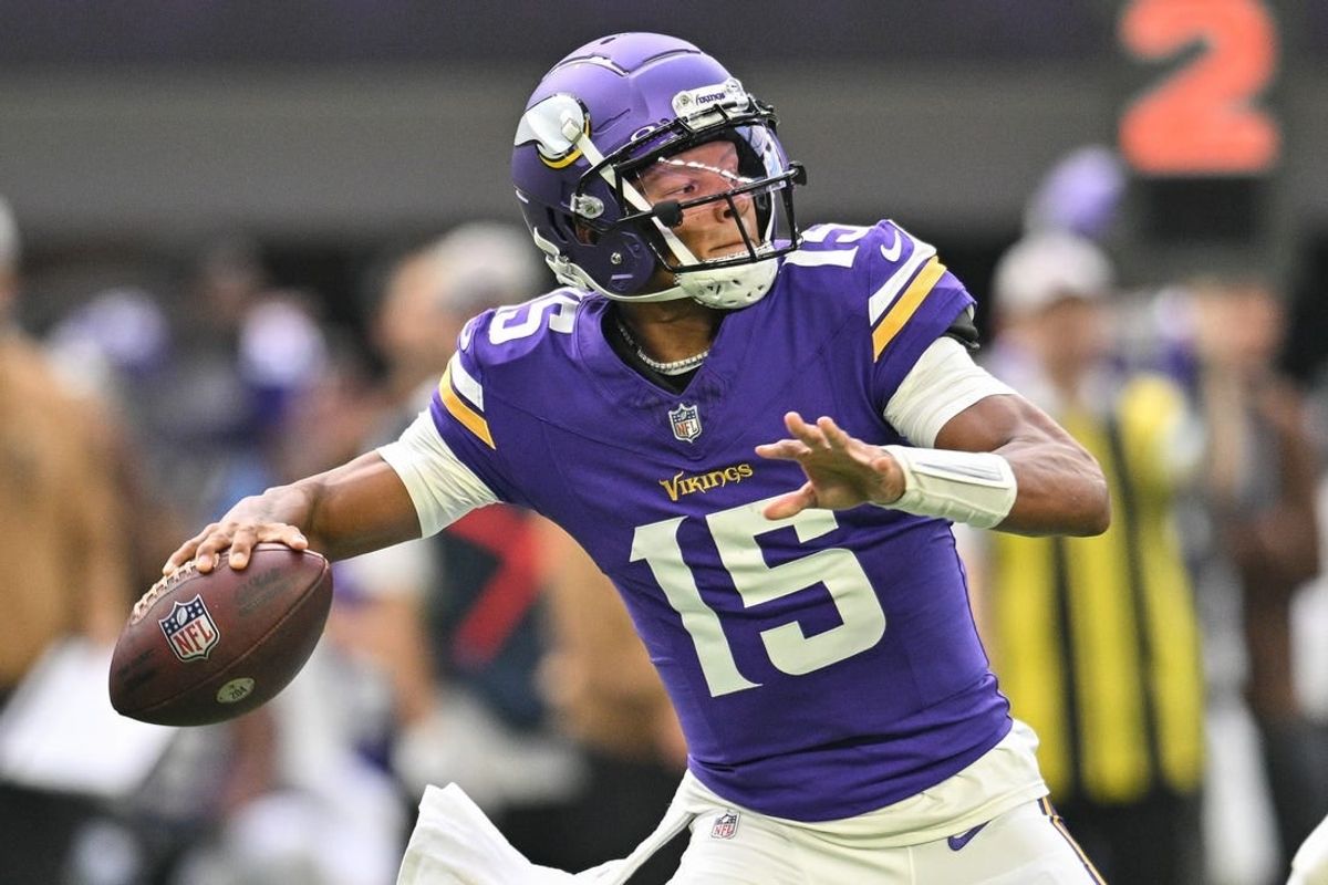 Nov 12, 2023; Minneapolis, Minnesota, USA; Minnesota Vikings quarterback Joshua Dobbs (15) throws a pass against the New Orleans Saints during the first quarter at U.S. Bank Stadium.