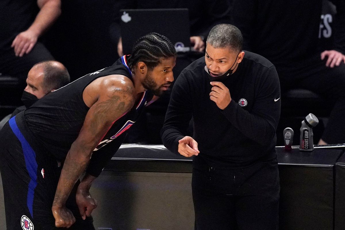 Paul George  with Clippers head coach Tyronn Lue.
