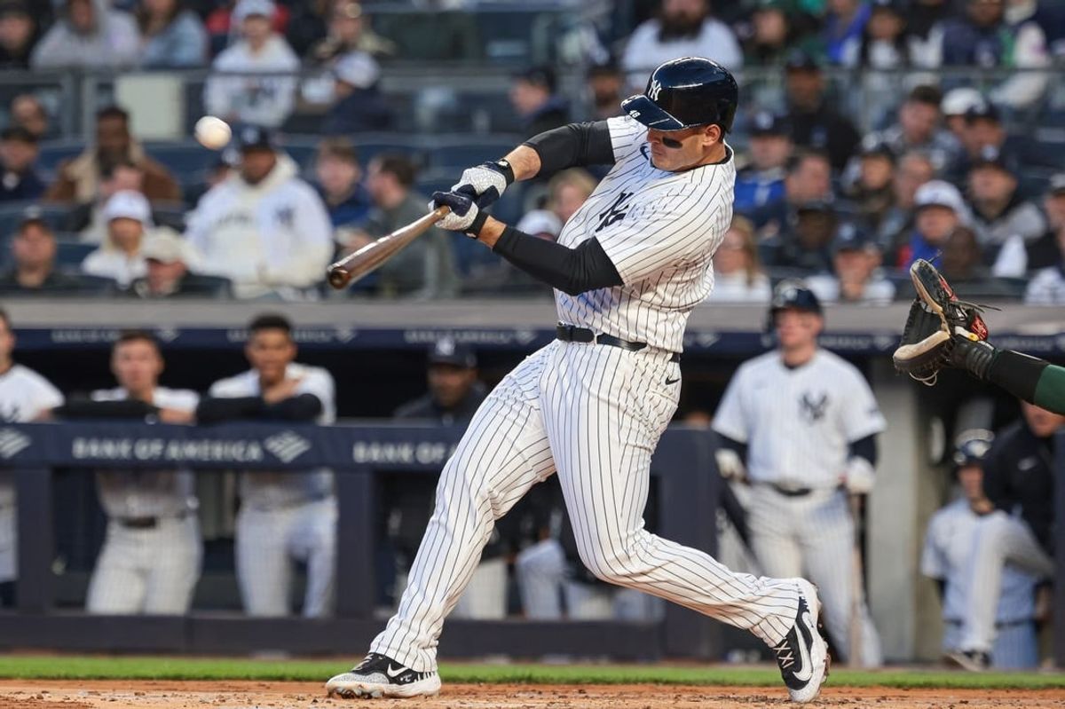 Apr 23, 2024; Bronx, New York, USA; New York Yankees first base Anthony Rizzo (48) hits a two-run home run during the first inning against the Oakland Athletics at Yankee Stadium.