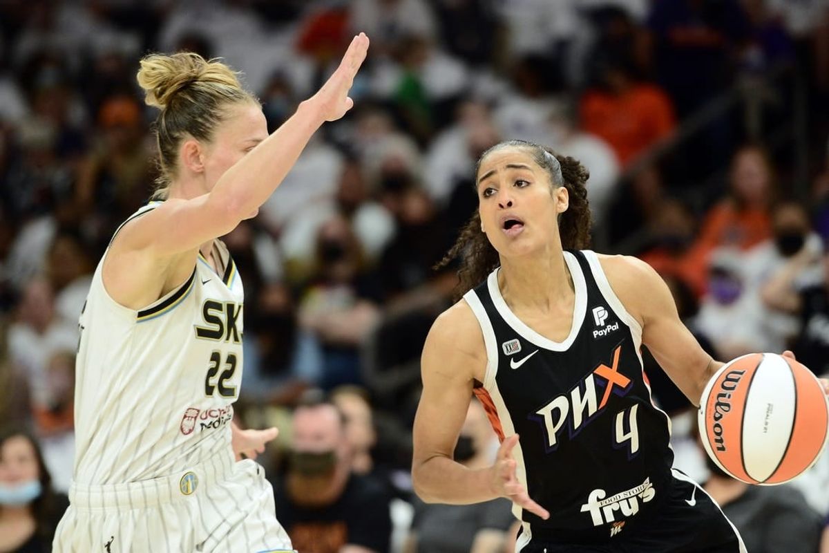 Oct 10, 2021; Phoenix, Arizona, USA; Phoenix Mercury guard Skylar Diggins-Smith (4) dribbles against Chicago Sky guard Courtney Vandersloot (22) during the first half of game one of the 2021 WNBA Finals at Footprint Center.