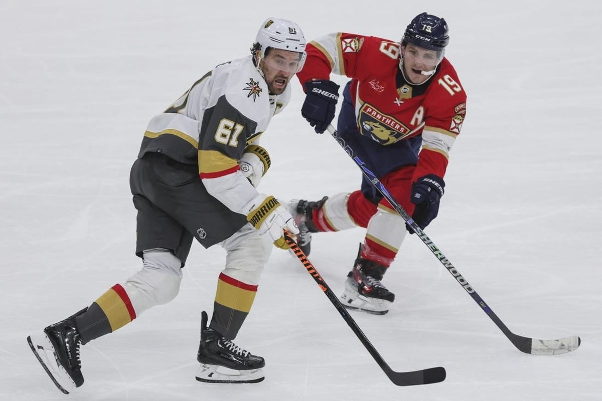 Dec 23, 2023; Sunrise, Florida, USA; Vegas Golden Knights right wing Mark Stone (61) and Florida Panthers left wing Matthew Tkachuk (19) look on during the third period at Amerant Bank Arena.