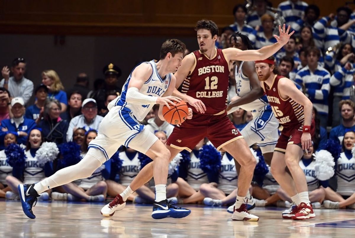 Feb 10, 2024; Durham, North Carolina, USA; Duke Blue Devils center Kyle Filipowski (30) drives to the basket against Boston College Eagles center Quinten Post (12) during the first half  at Cameron Indoor Stadium.