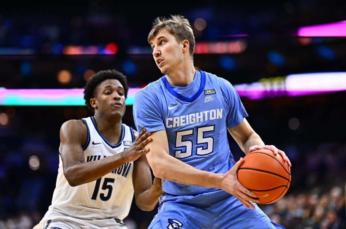 Mar 9, 2024; Philadelphia, Pennsylvania, USA; Creighton Bluejays guard Baylor Scheierman (55) controls the ball against Villanova Wildcats guard Jordan Longino (15) in the first half at Wells Fargo Center.