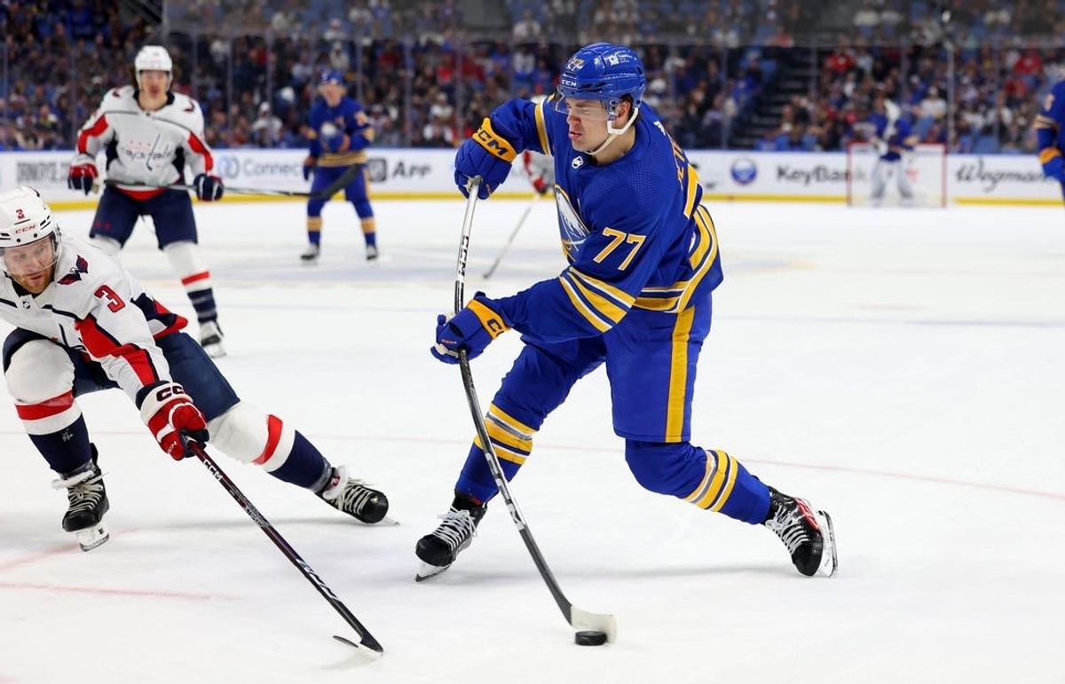 Apr 11, 2024; Buffalo, New York, USA;  Washington Capitals defenseman Nick Jensen (3) tries to block a shot by Buffalo Sabres right wing JJ Peterka (77) during the second period at KeyBank Center.