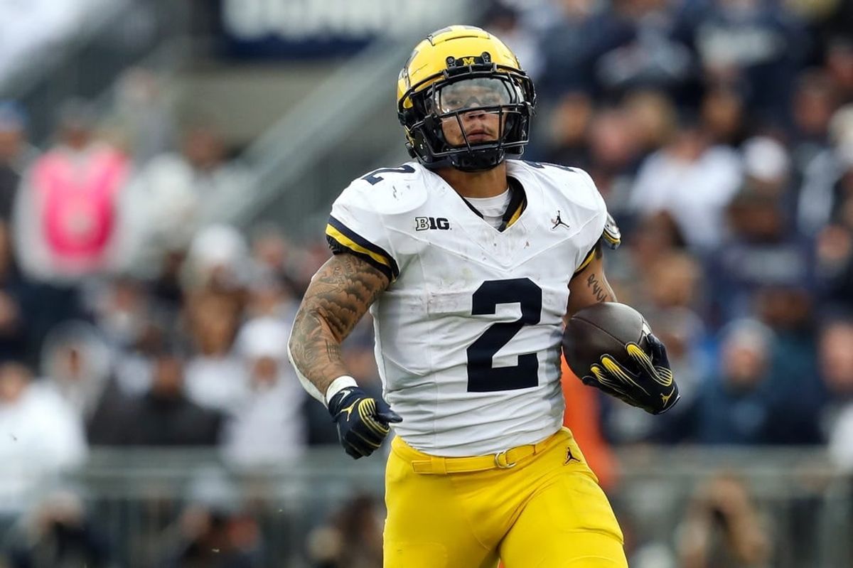 Nov 11, 2023; University Park, Pennsylvania, USA; Michigan Wolverines running back Blake Corum (2) runs the ball against the Penn State Nittany Lions during the second quarter at Beaver Stadium. Michigan won 24-15.