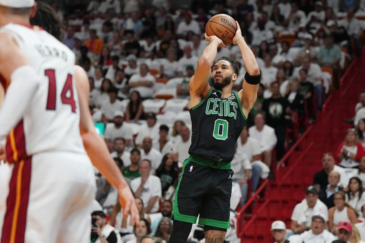 Apr 27, 2024; Miami, Florida, USA; Boston Celtics forward Jayson Tatum (0) takes a shot against the Miami Heat in the first half during game three of the first round for the 2024 NBA playoffs at Kaseya Center.