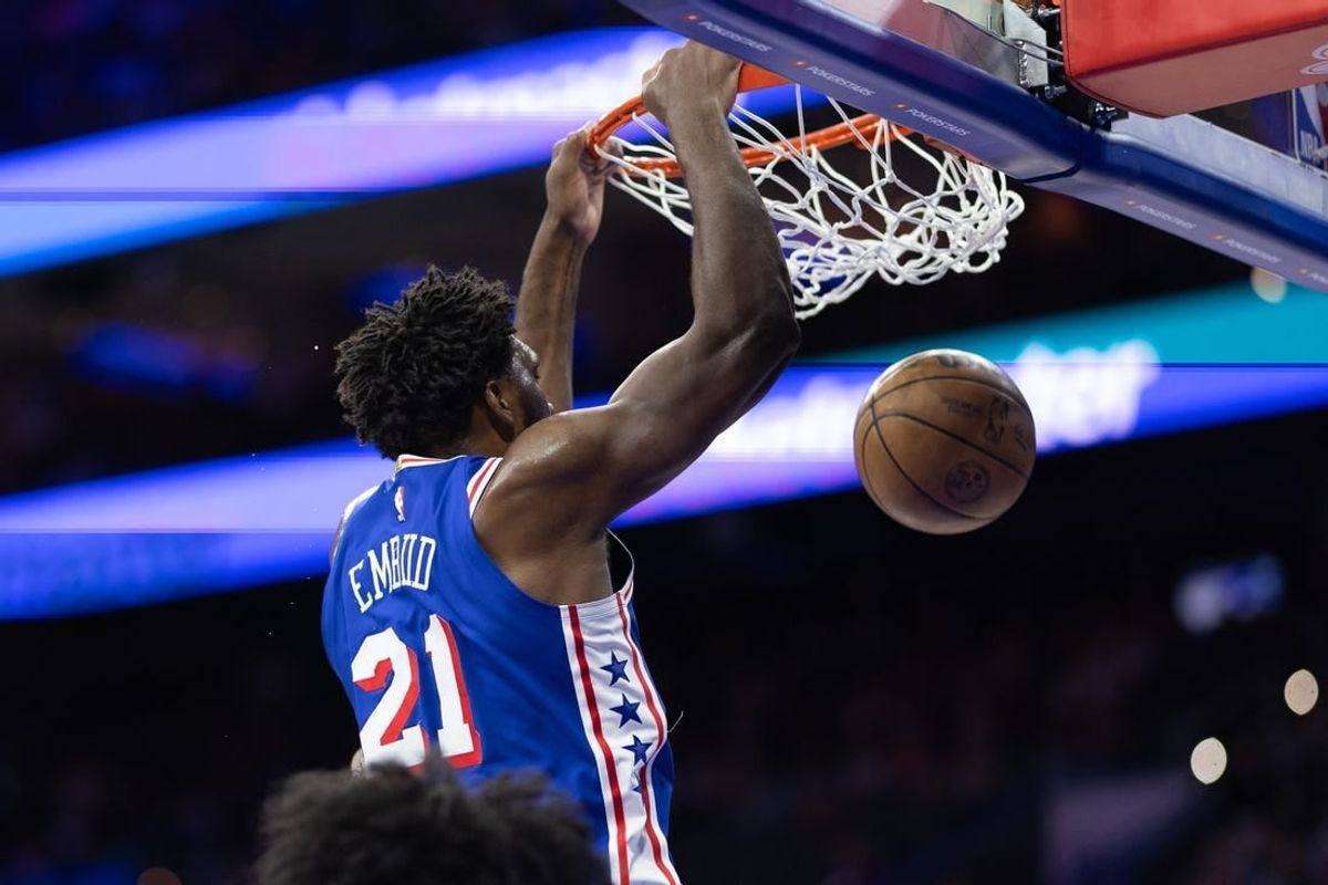 Dec 18, 2023; Philadelphia, Pennsylvania, USA; Philadelphia 76ers center Joel Embiid (21) dunks the ball against the Chicago Bulls during the first quarter at Wells Fargo Center.