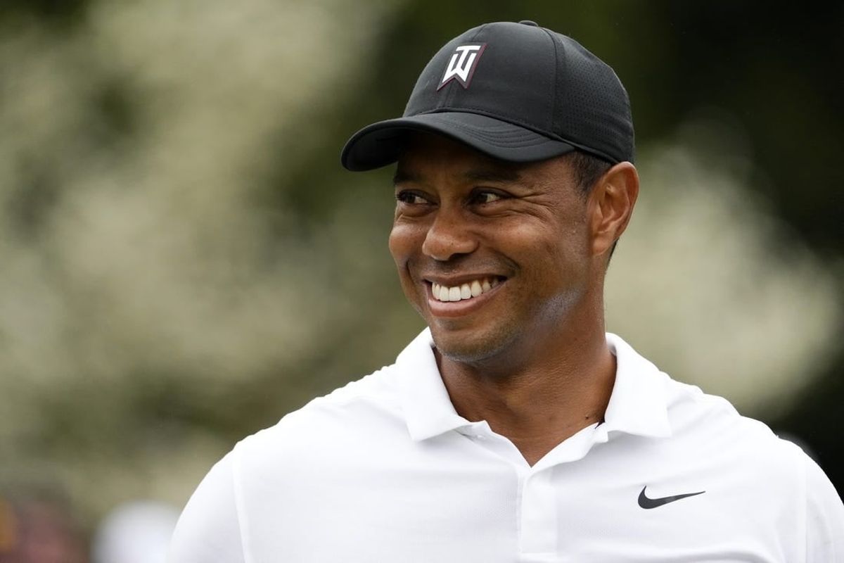 Apr 6, 2022; Augusta, Georgia, USA; Tiger Woods smiles at the practice facility during a practice round of The Masters golf tournament at Augusta National Golf Club.