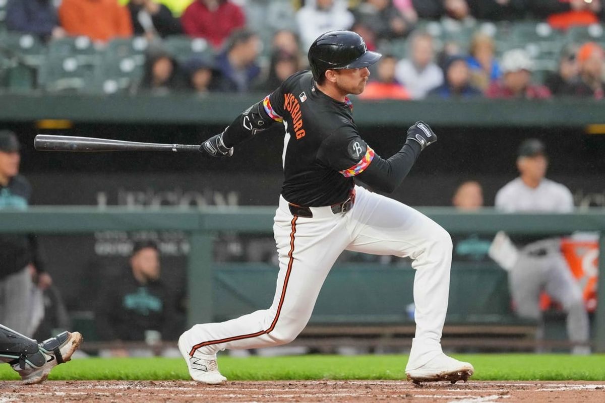 May 10, 2024; Baltimore, Maryland, USA; Baltimore Orioles  third baseman Jordan Westburg (11) hits a  double in the second inning to drive in a run against the Arizona Diamondbacks at Oriole Park at Camden Yards.