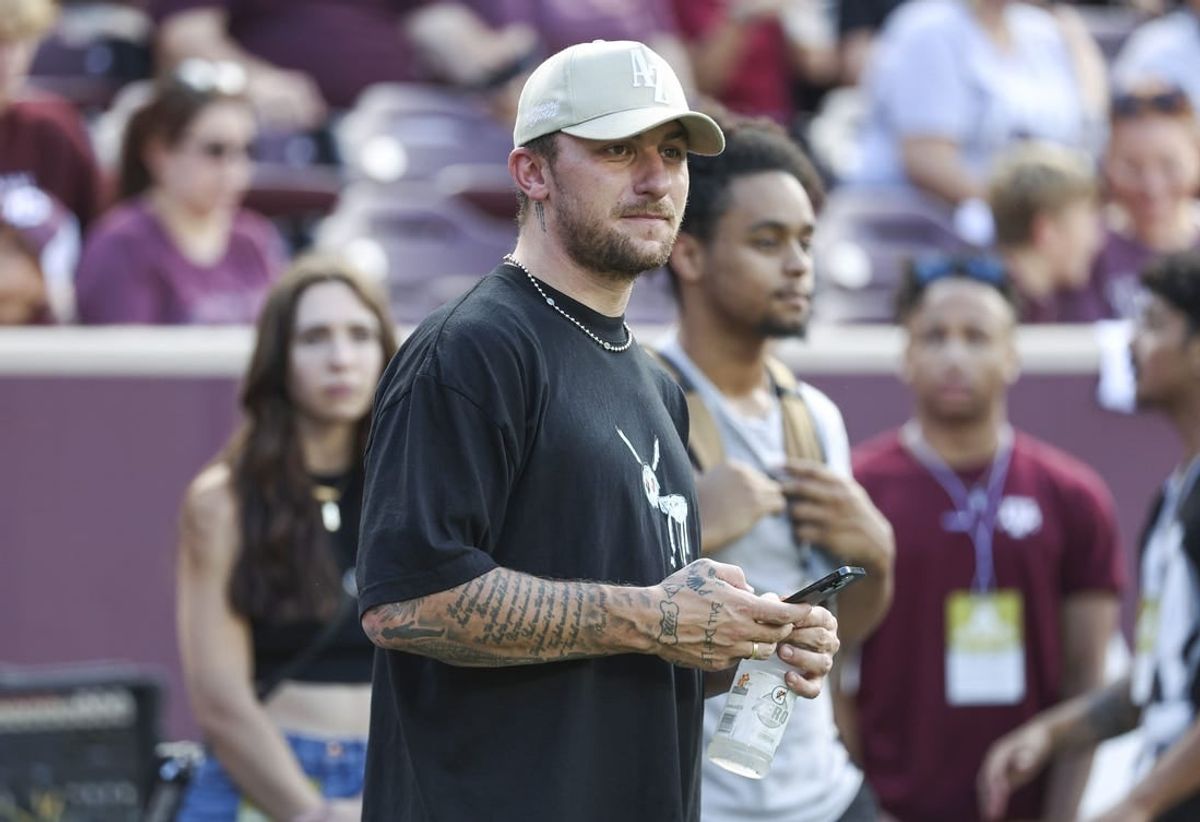 Sep 16, 2023; College Station, Texas, USA; Former Texas A&M Aggies player Johnny Manziel watches from the sideline during the first half of the game between the Aggies and the Louisiana Monroe Warhawks at Kyle Field.