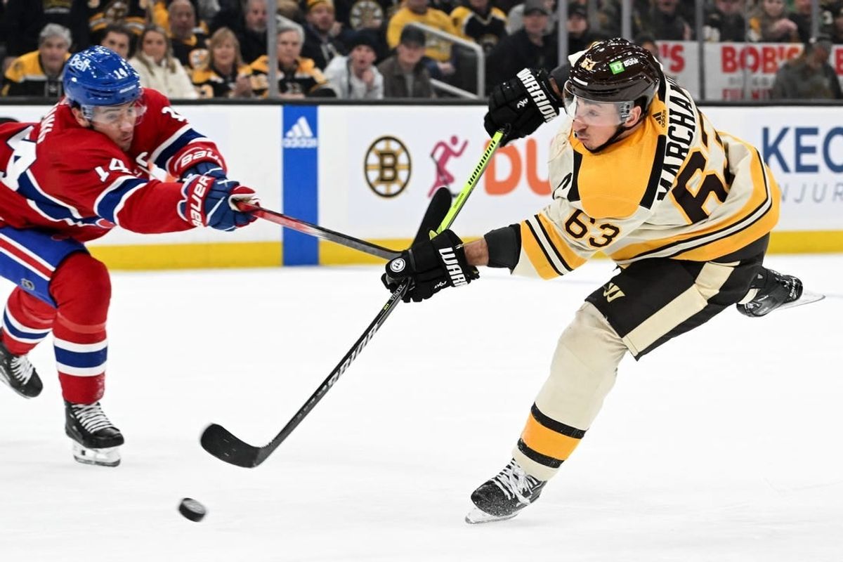 Jan 20, 2024; Boston, Massachusetts, USA; Boston Bruins left wing Brad Marchand (63) takes a shot against the Montreal Canadiens during the first period at the TD Garden.