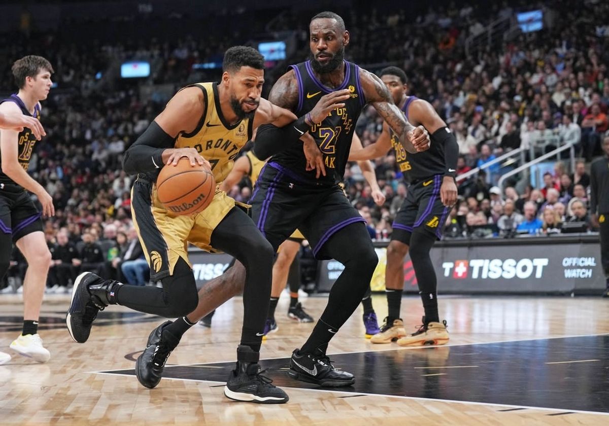 Apr 2, 2024; Toronto, Ontario, CAN; Toronto Raptors forward Garrett Temple (17) controls the ball as Los Angeles Lakers forward LeBron James (23) tries to defend during the third quarter at Scotiabank Arena.