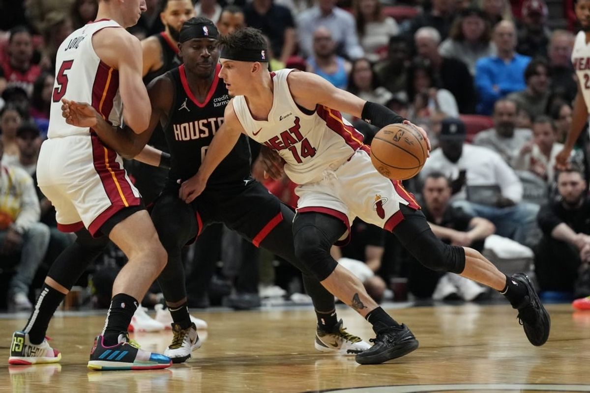 Jan 8, 2024; Miami, Florida, USA;  Miami Heat guard Tyler Herro (14) drives toward the basket against the Houston Rockets during the first half at Kaseya Center.