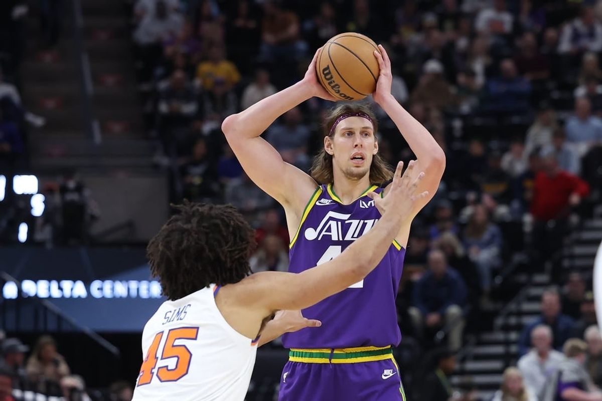 Dec 13, 2023; Salt Lake City, Utah, USA; Utah Jazz forward Kelly Olynyk (41) looks to pass the ball against New York Knicks center Jericho Sims (45) during the third quarter at Delta Center.