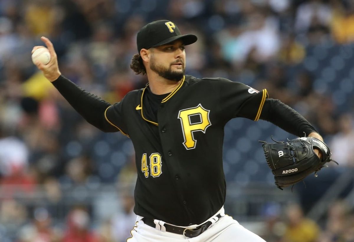 Aug 20, 2022; Pittsburgh, Pennsylvania, USA; Pittsburgh Pirates starting pitcher Tyler Beede (48) delivers a pitch  against the Cincinnati Reds during the first inning at PNC Park.