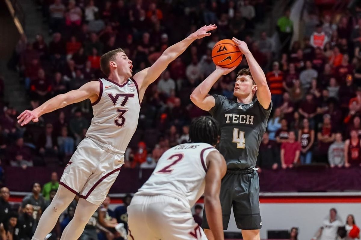 Jan 27, 2024; Blacksburg, Virginia, USA; Georgia Tech Yellow Jackets guard Carter Murphy (4) shoots while being defended by Virginia Tech Hokies guard Sean Pedulla (3) during the first half at Cassell Coliseum.