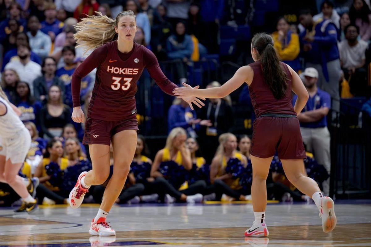 Nov 30, 2023; Baton Rouge, Louisiana, USA;  Virginia Tech Hokies center Elizabeth Kitley (33) slaps hands with Virginia Tech Hokies guard Georgia Amoore (5) against the LSU Lady Tigers during the second half at Pete Maravich Assembly Center.