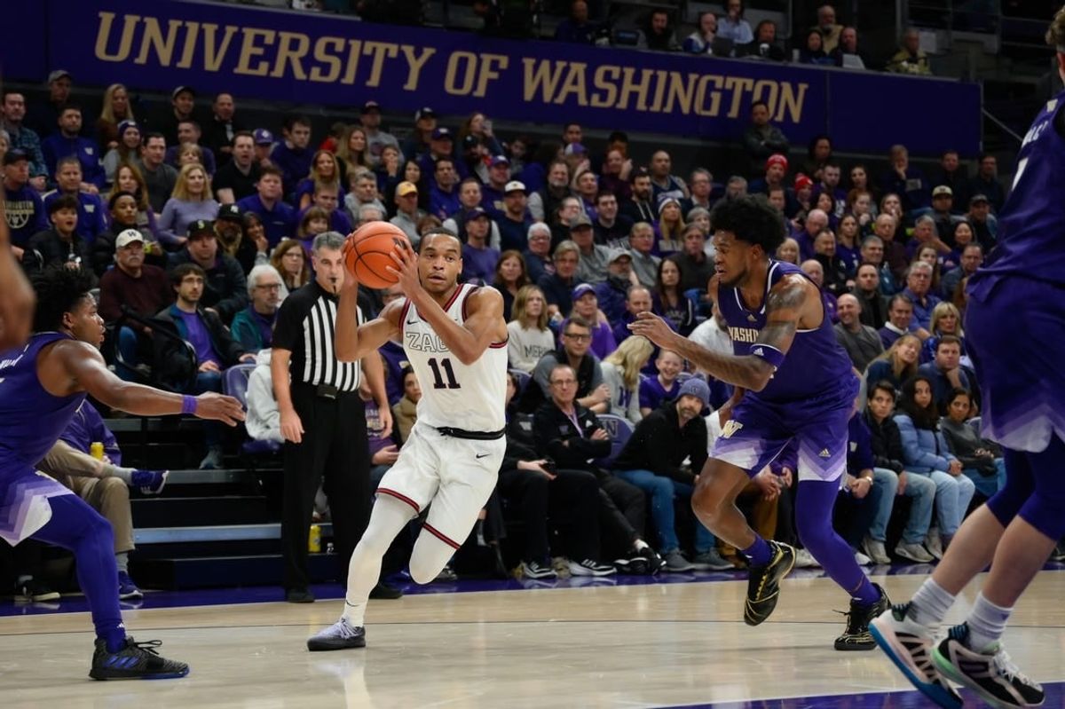 Dec 9, 2023; Seattle, Washington, USA; Gonzaga Bulldogs guard Nolan Hickman (11) drives the ball to the basket against the Washington Huskies during the second half at Alaska Airlines Arena at Hec Edmundson Pavilion.