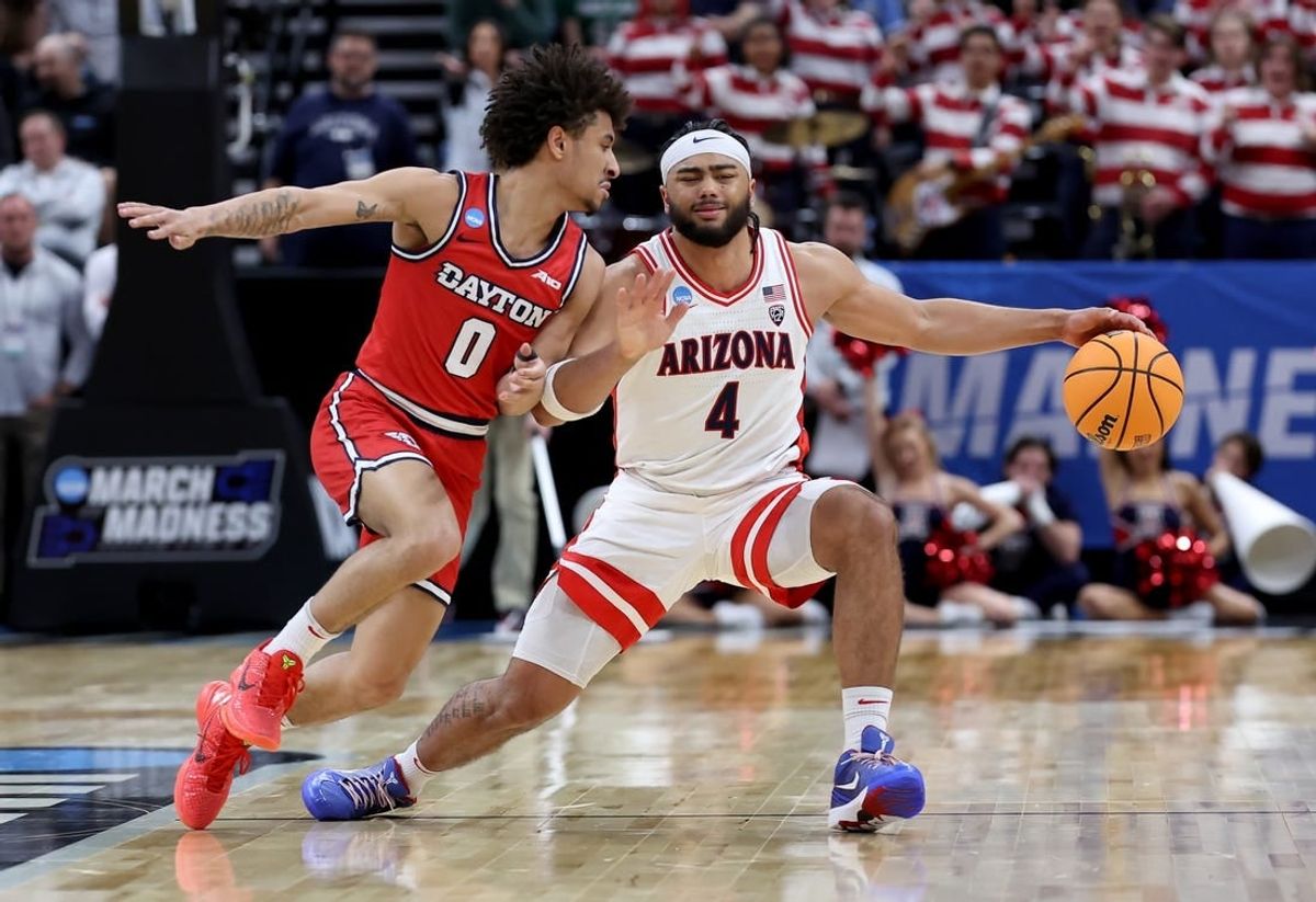 Mar 23, 2024; Salt Lake City, UT, USA; Arizona Wildcats guard Kylan Boswell (4) dribbles against Dayton Flyers guard Javon Bennett (0) during the first half in the second round of the 2024 NCAA Tournament at Vivint Smart Home Arena-Delta Center.