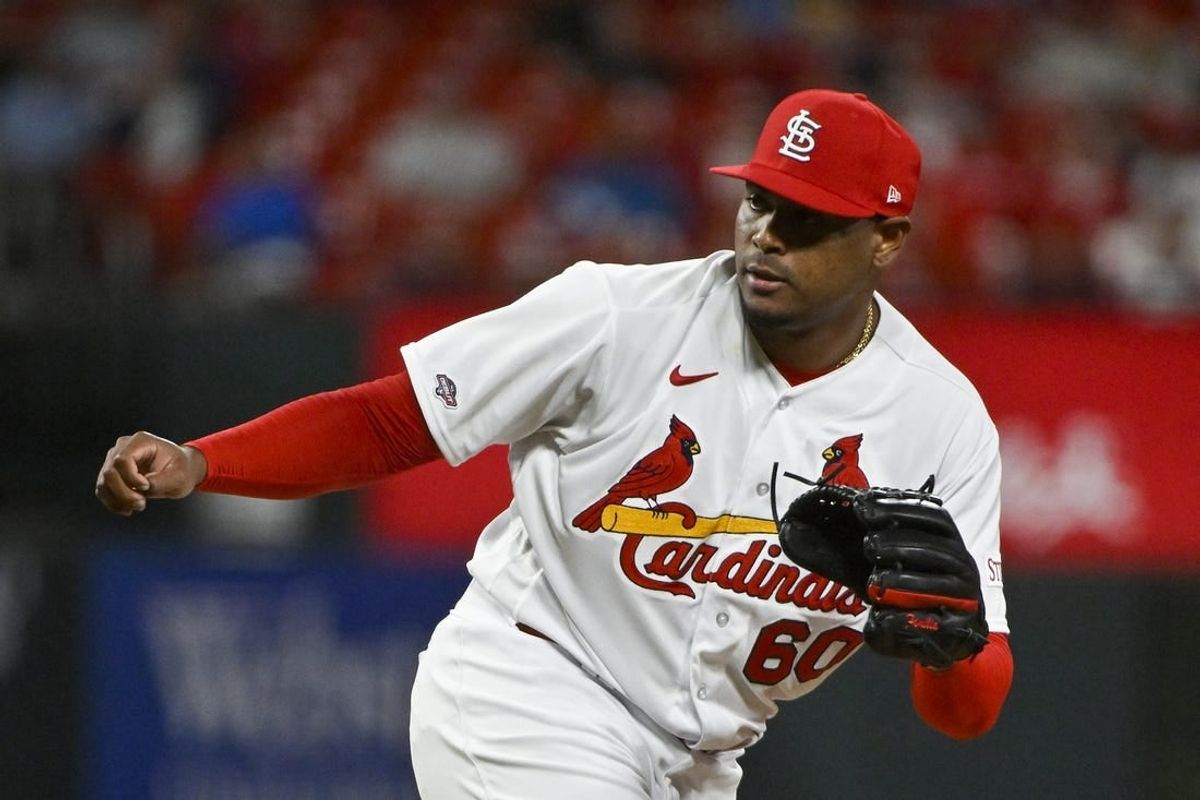 May 2, 2023; St. Louis, Missouri, USA;  St. Louis Cardinals relief pitcher Guillermo Zuniga (60) pitches in his MLB debut against the Los Angeles Angels during the ninth inning at Busch Stadium.