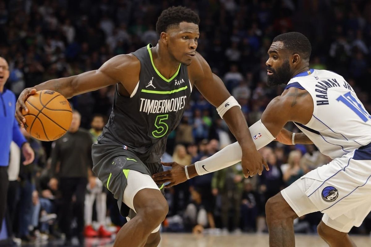 Dec 28, 2023; Minneapolis, Minnesota, USA; Minnesota Timberwolves guard Anthony Edwards (5) works against Dallas Mavericks guard Tim Hardaway Jr. (10) in the fourth quarter at Target Center.