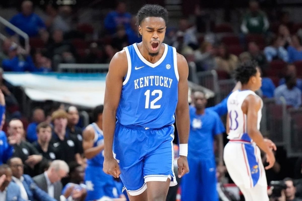 Nov 14, 2023; Chicago, Illinois, USA; Kentucky Wildcats guard Antonio Reeves (12) reacts after scoring against the Kansas Jayhawks during the second half at United Center.