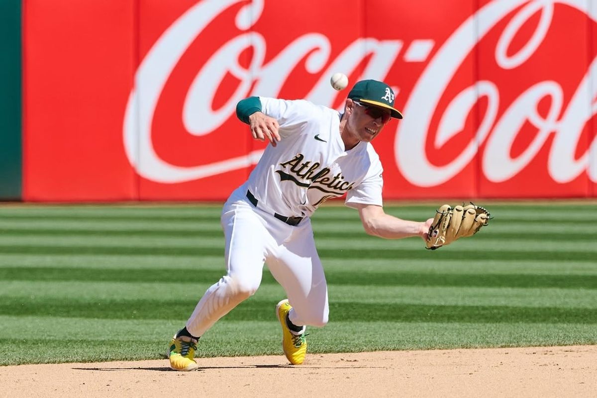 Mar 31, 2024; Oakland, California, USA; Oakland Athletics infielder Nick Allen (10) makes an error against the Cleveland Guardians during the eighth inning at Oakland-Alameda County Coliseum.