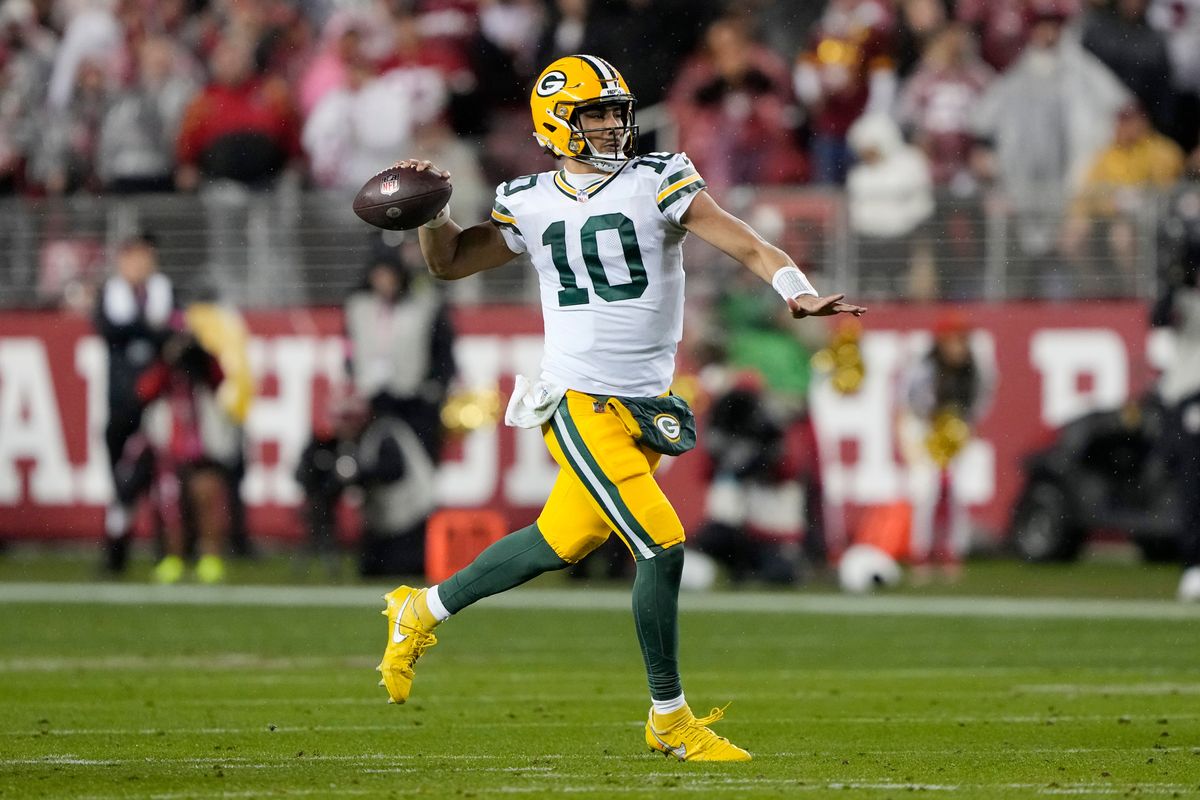 Jordan Love of the Green Bay Packers looks to pass during the first half against the San Francisco 49ers in the NFC Divisional Playoffs at Levi’s Stadium.