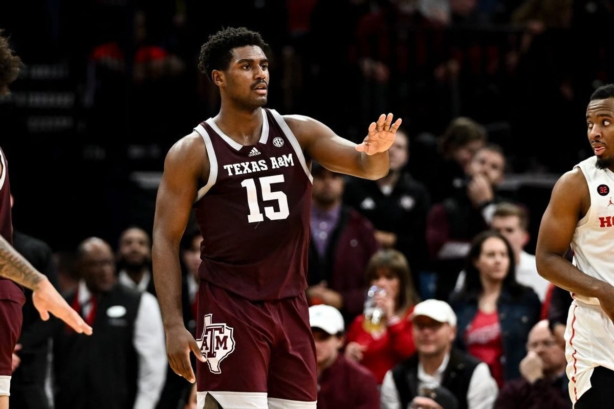 Dec 16, 2023; Houston, Texas, USA; Texas A&M Aggies forward Henry Coleman III (15) motions during a time-out in the second half against the Houston Cougars at Toyota Center.