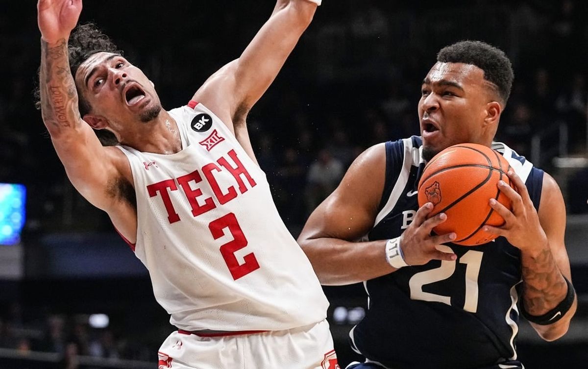 Butler Bulldogs guard Pierre Brooks II (21) runs into Texas Tech Red Raiders guard Pop Isaacs (2) on Thursday, Nov. 30, 2023, during the game at Hinkle Fieldhouse in Indianapolis. The Butler Bulldogs defeated the Texas Tech Red Raiders in overtime, 103-95.