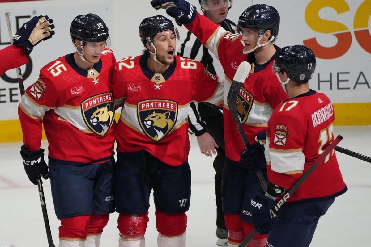 Feb 20, 2024; Sunrise, Florida, USA; Florida Panthers defenseman Brandon Montour (62) celebrates scoring a goal with teammates against the Ottawa Senators during the second period at Amerant Bank Arena.