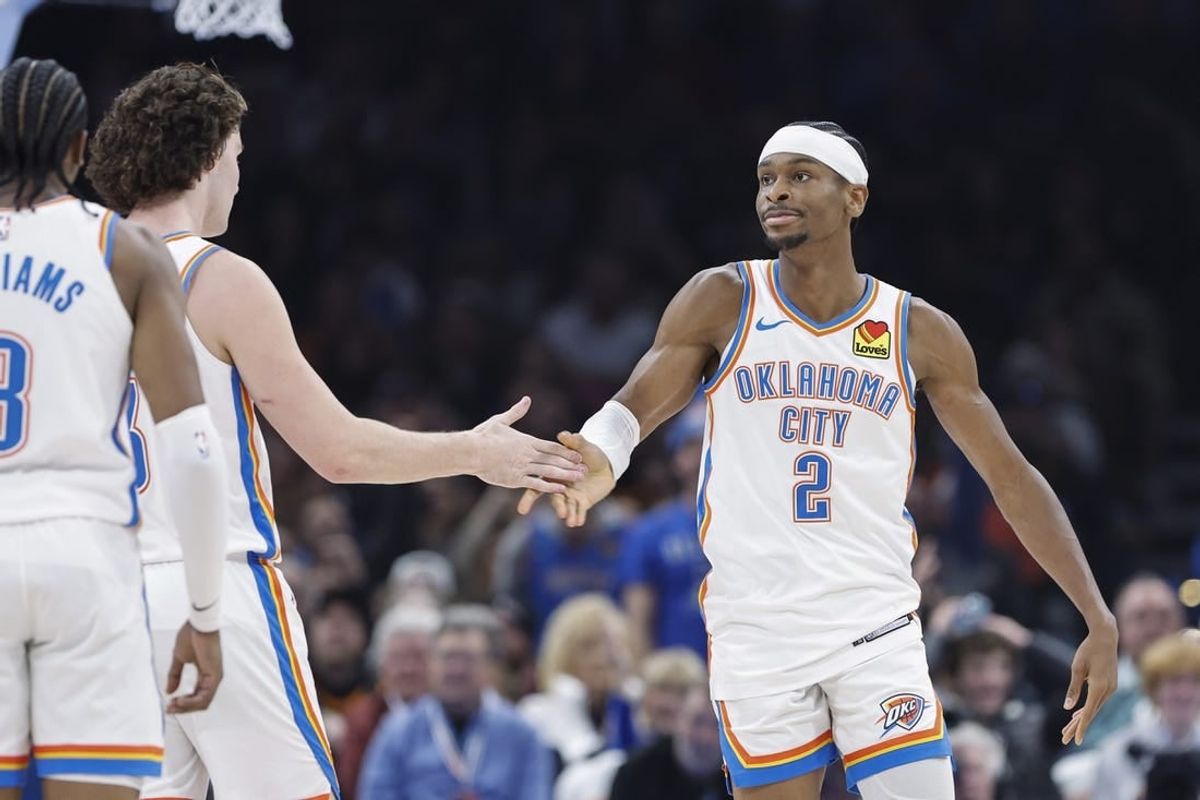 Jan 13, 2024; Oklahoma City, Oklahoma, USA; Oklahoma City Thunder guard Shai Gilgeous-Alexander (2) celebrates with guard Josh Giddey (3) after scoring against the Orlando Magic during the second quarter at Paycom Center.