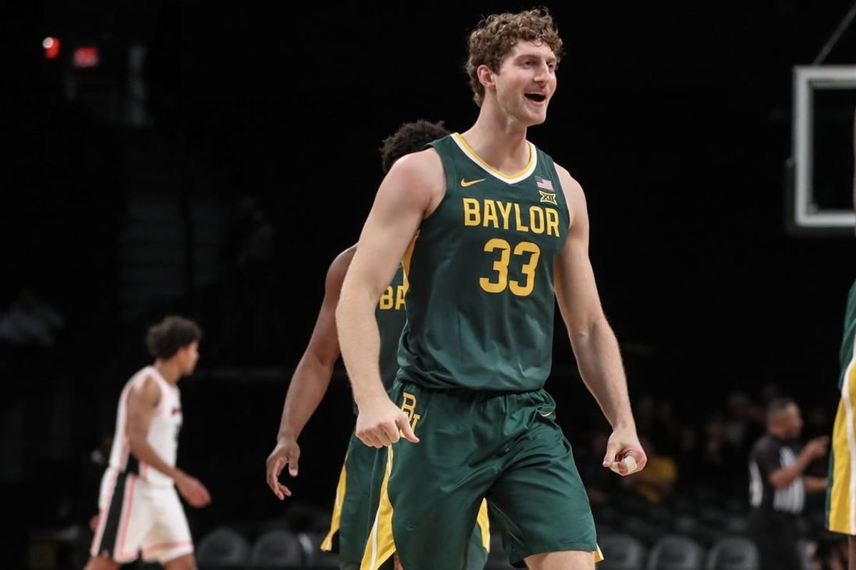 Nov 22, 2023; Brooklyn, NY, USA; Baylor Bears forward Caleb Lohner (33) celebrates after the Oregon State Beavers call a timeout in the first half at Barclay Center.