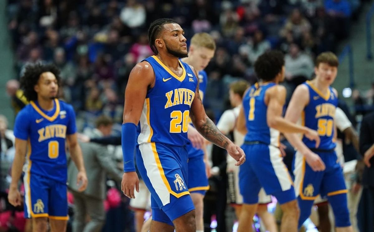 Jan 28, 2024; Hartford, Connecticut, USA; Xavier Musketeers guard Dayvion McKnight (20) and teammates head to the sideline as they take on the UConn Huskies in the first half at XL Center.