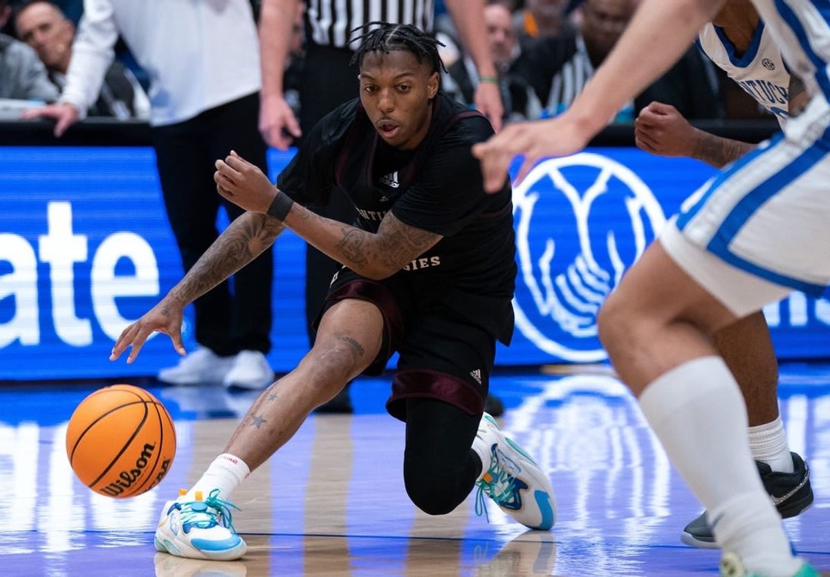 Texas A&M Aggies guard Wade Taylor IV (4) handles the ball against Kentucky during their SEC Men's Basketball Tournament quarterfinal game at Bridgestone Arena in Nashville, Tenn., Friday, March 15, 2024 at Bridgestone Arena in Nashville, Tenn., Friday, March 15, 2024.