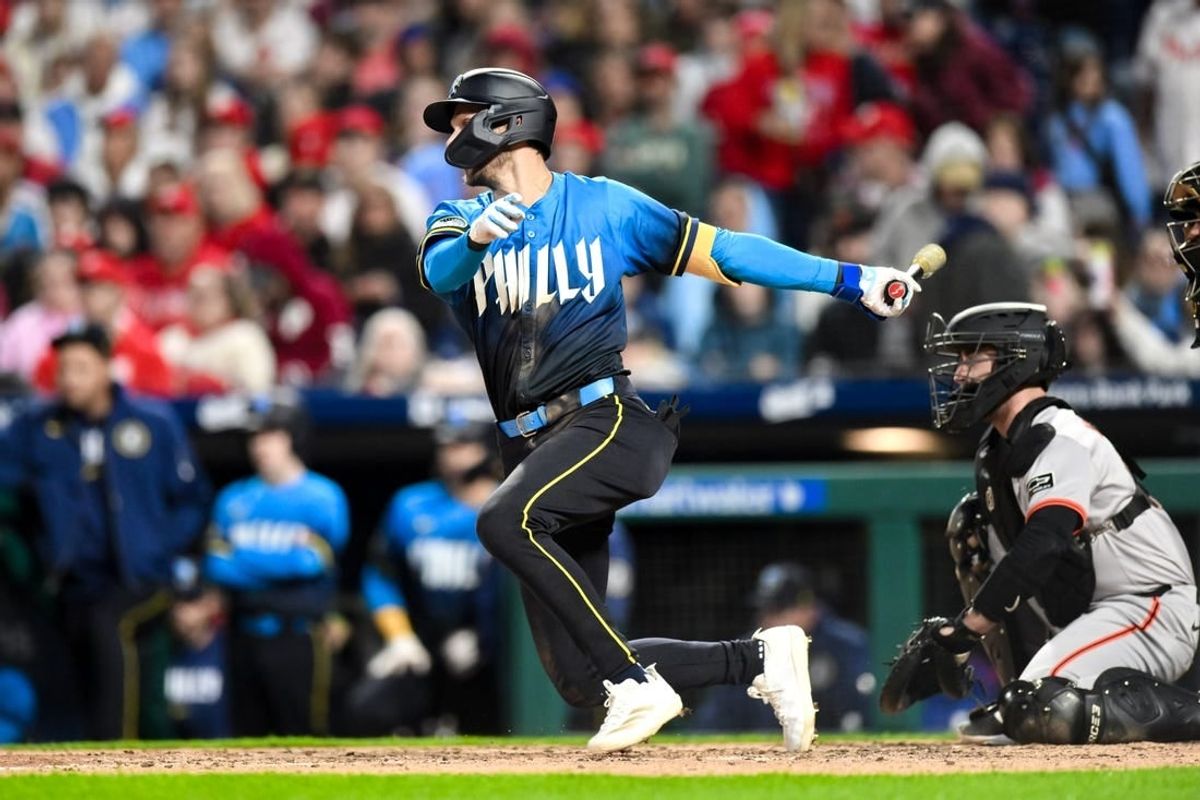 May 3, 2024; Philadelphia, Pennsylvania, USA; Philadelphia Phillies shortstop Trea Turner (7) hits a single against the San Francisco Giants during the fourth inning at Citizens Bank Park.
