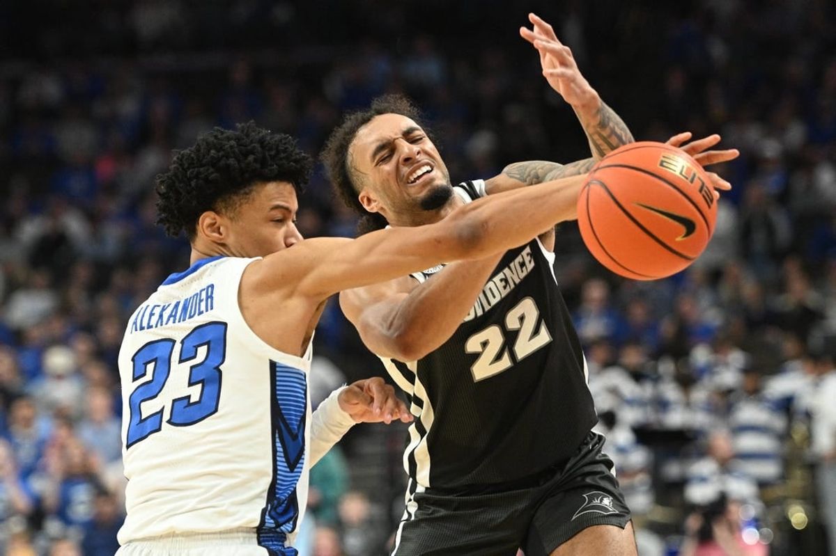 Jan 6, 2024; Omaha, Nebraska, USA; Creighton Bluejays guard Trey Alexander (23) fouls Providence Friars guard Devin Carter (22) on an attempted steal in the first half at CHI Health Center Omaha.