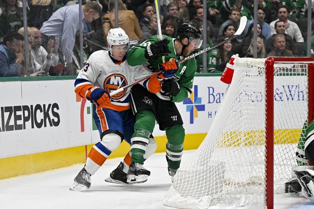 Feb 26, 2024; Dallas, Texas, USA; New York Islanders center Casey Cizikas (53) and Dallas Stars center Joe Pavelski (16) in action during the game between the Dallas Stars and the New York Islanders at the American Airlines Center.