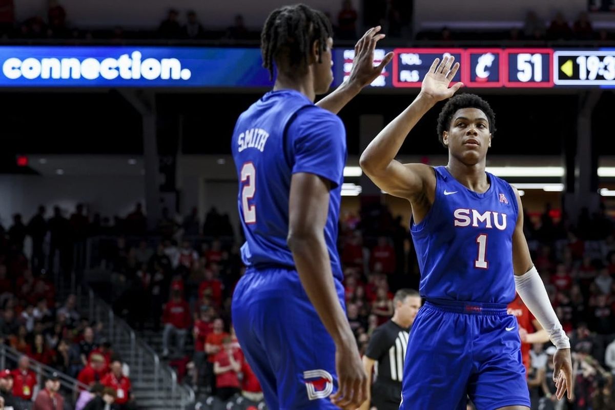Mar 5, 2023; Cincinnati, Ohio, USA;  Southern Methodist Mustangs guard Zhuric Phelps (1) high-fives guard Jalen Smith (2) during a stop in play against the Cincinnati Bearcats in the second half at Fifth Third Arena.