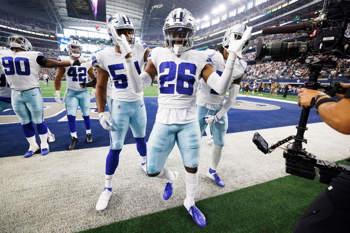 Jourdan Lewis (center) and teammates