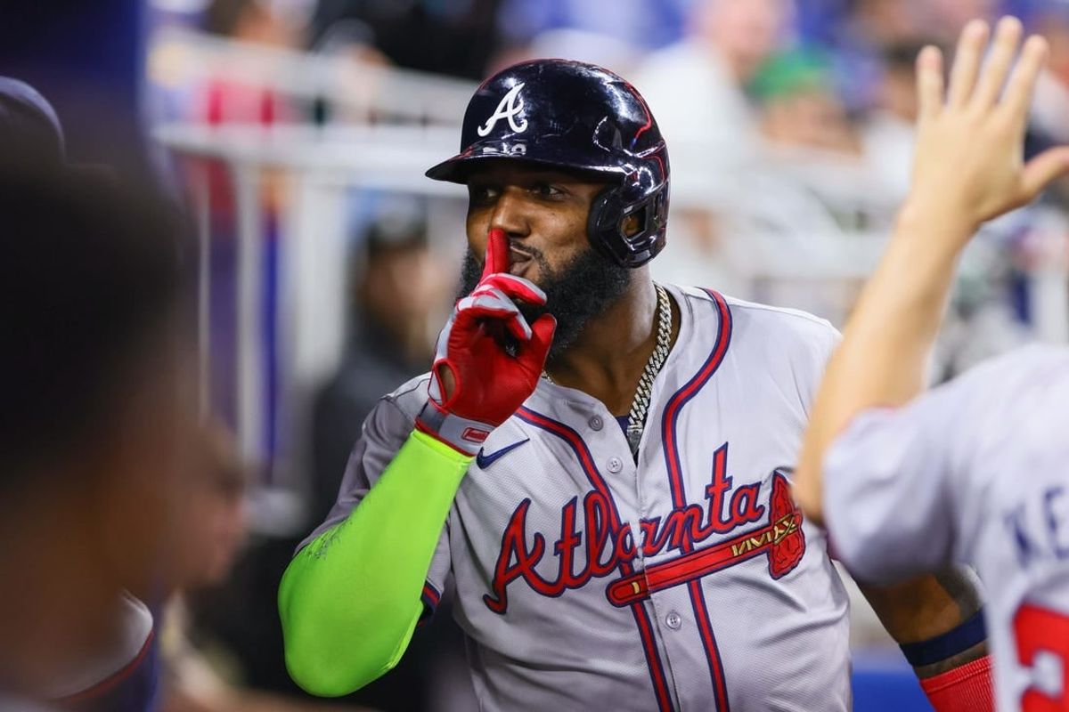 Apr 12, 2024; Miami, Florida, USA; Atlanta Braves designated hitter Marcell Ozuna (20) celebrates after hitting a home run against the Miami Marlins during the ninth inning at loanDepot Park.