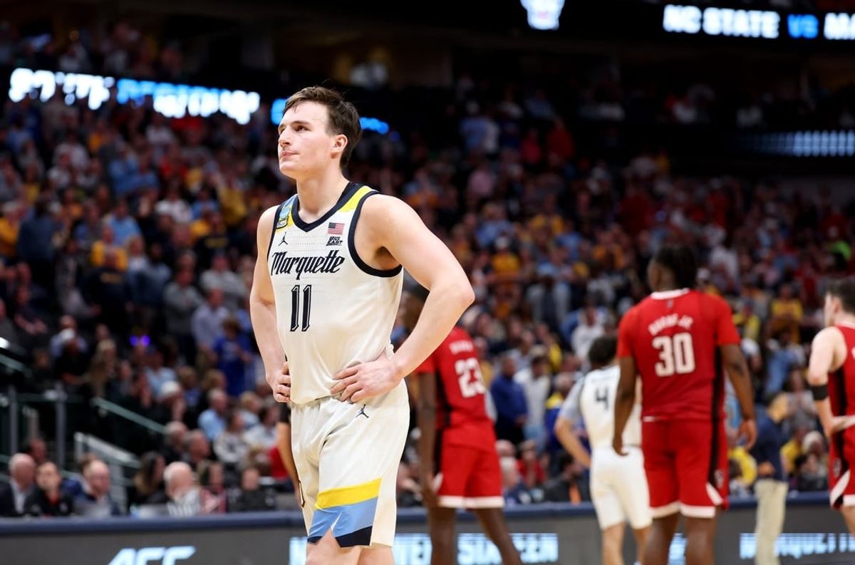 Mar 29, 2024; Dallas, TX, USA; Marquette Golden Eagles guard Tyler Kolek (11) reacts during the second half in the semifinals of the South Regional of the 2024 NCAA Tournament against the North Carolina State Wolfpack at American Airlines Center.