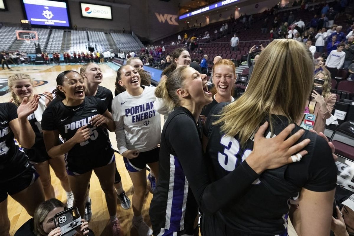 March 11, 2024; Las Vegas, NV, USA; Portland Pilots forward Kennedy Dickie (12) celebrates with forward Lucy Cochrane (30) against the Santa Clara Broncos after the game in the semifinals of the WCC Basketball Championship at Orleans Arena.