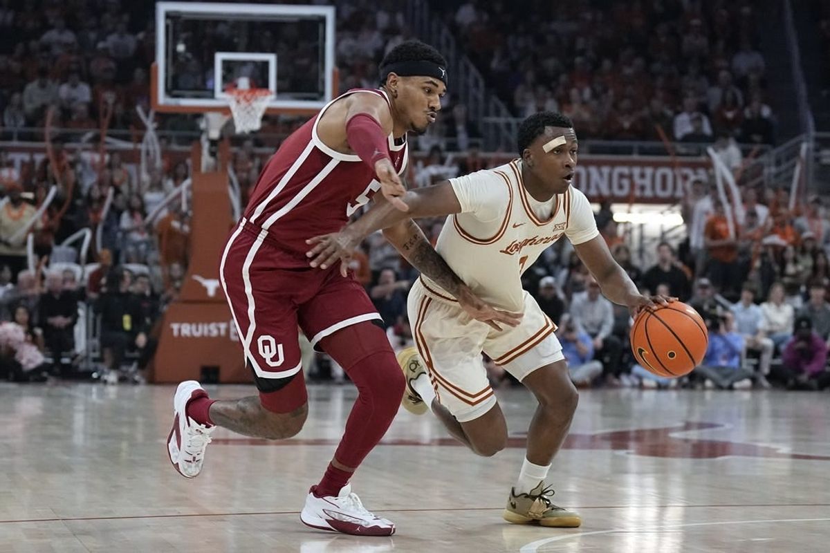 Mar 9, 2024; Austin, Texas, USA; Texas Longhorns guard Max Abmas (3) drives to the basket while defended by Oklahoma Sooners guard Rivaldo Soares (5) during the first half at Moody Center.