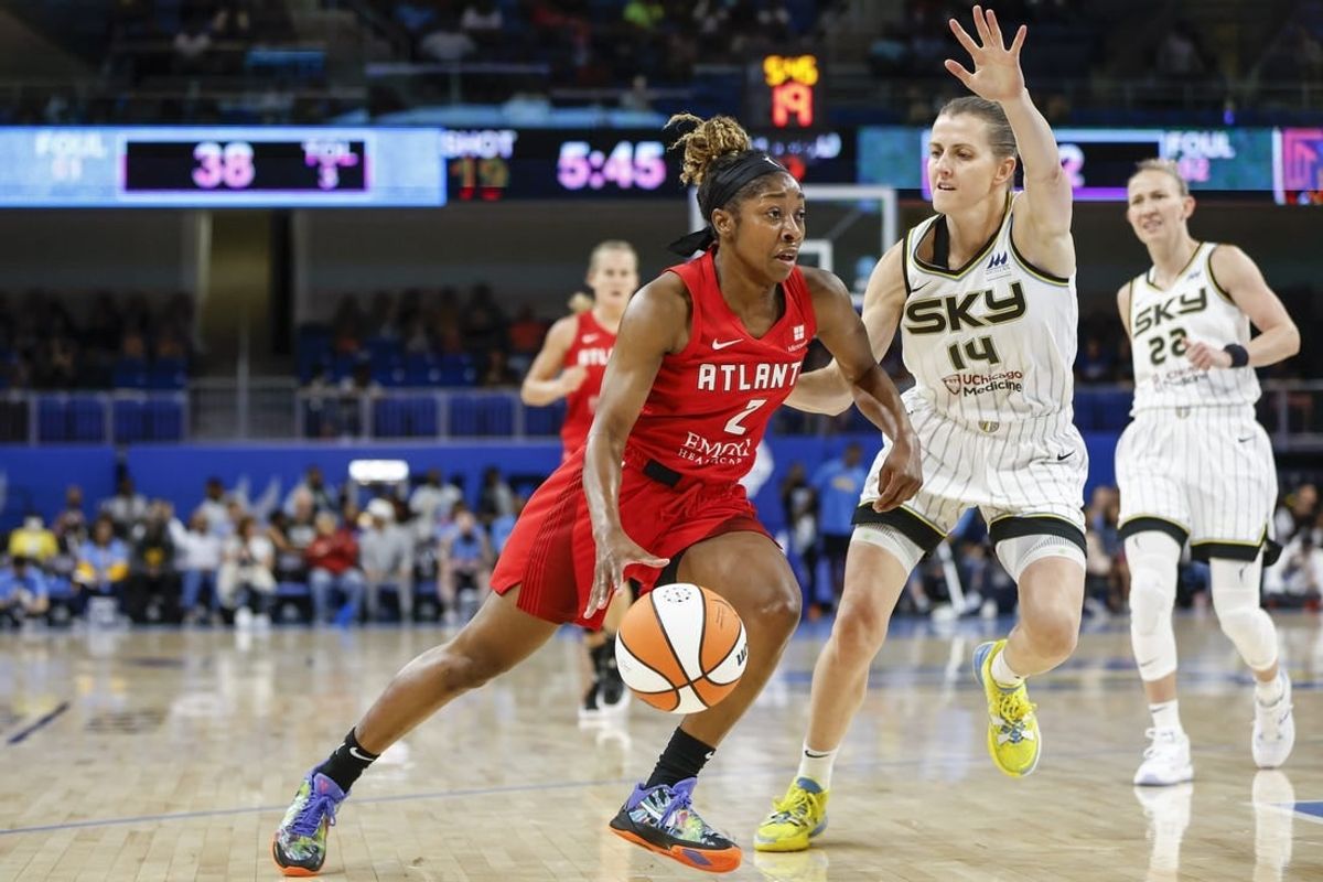 Jun 17, 2022; Chicago, Illinois, USA; Atlanta Dream guard Aari McDonald (2) drives to the basket against Chicago Sky guard Allie Quigley (14) during the first half of a WNBA game at Wintrust Arena.