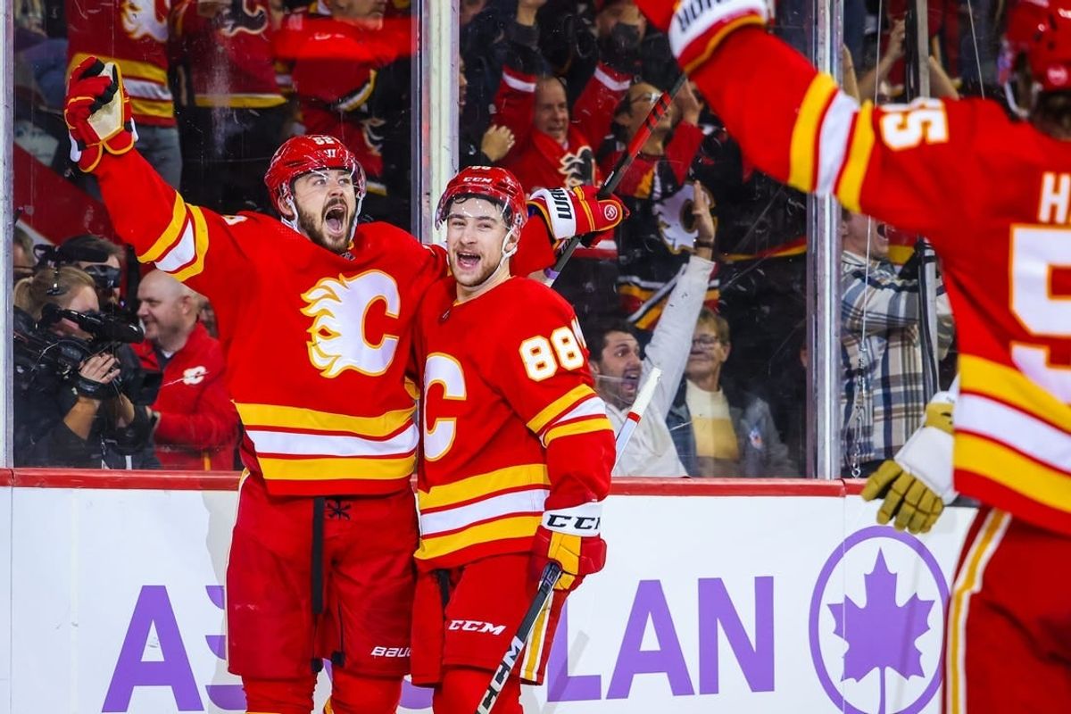 Nov 27, 2023; Calgary, Alberta, CAN; Calgary Flames defenseman MacKenzie Weegar (52) celebrates his goal against the Vegas Golden Knights during the overtime period at Scotiabank Saddledome.