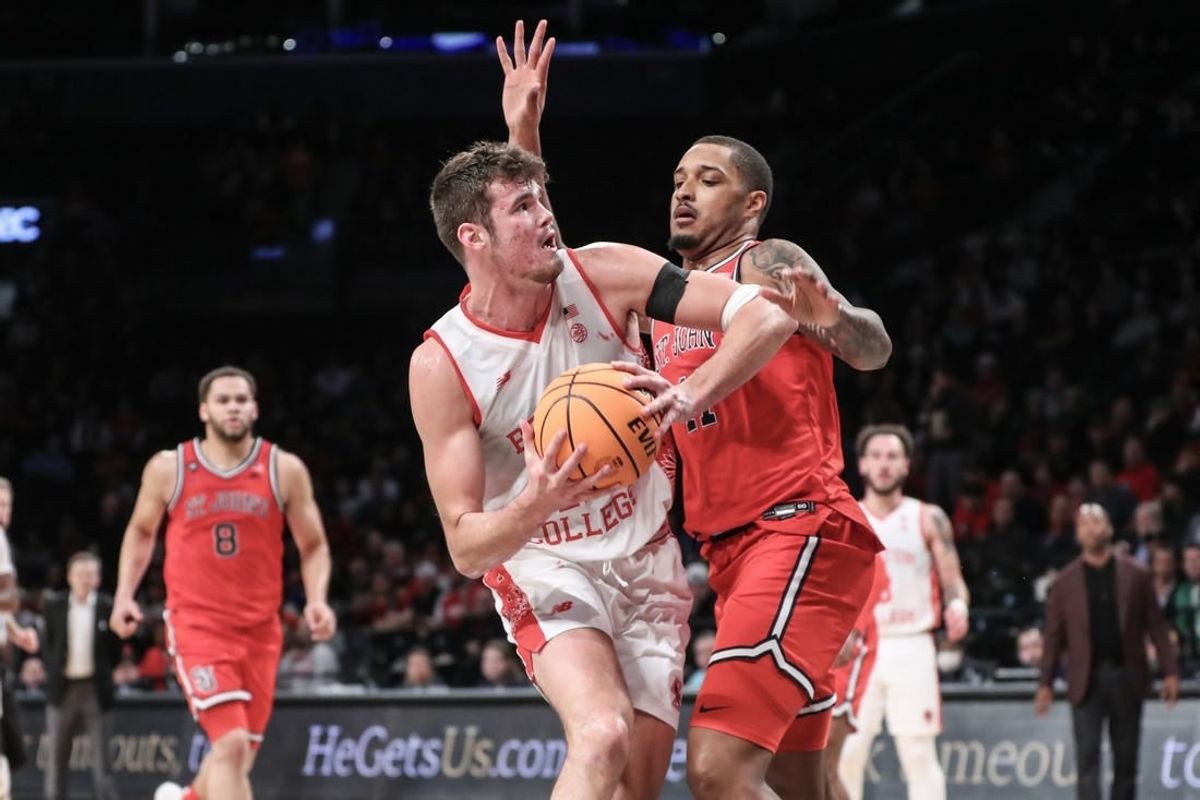 Dec 10, 2023; Brooklyn, New York, USA; Boston College Eagles forward Quinten Post (12) looks to post up against St. John's Red Storm center Joel Soriano (11) in the second half at Barclays Center.