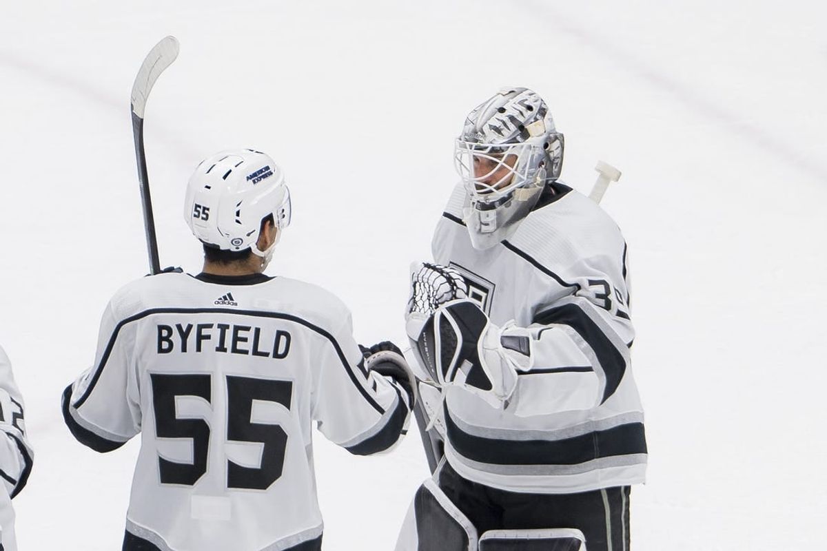 Feb 29, 2024; Vancouver, British Columbia, CAN; Los Angeles Kings forward Quinton Byfield (55) and goalie Cam Talbot (39) celebrate thier victory against the Vancouver Canucks at Rogers Arena. Kings won 5-1.